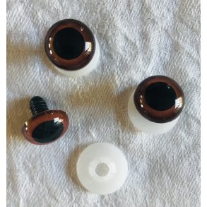 Brunt je med sort pupil