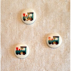 Knap med tog som motiv