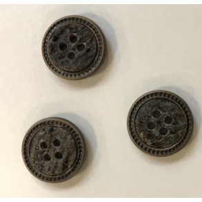 Knap udfrt i metal og med mnster