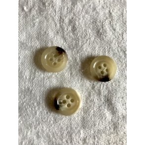 Lys knap med brune aftegninger