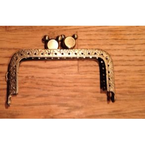 Taskehndtag med portmonee lukning