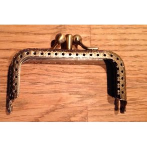 Taskehndtag med portmonee lukning